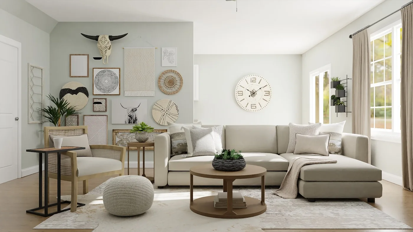 A light living room with a pale sectional sofa, a round timber coffee table and a gallery wall